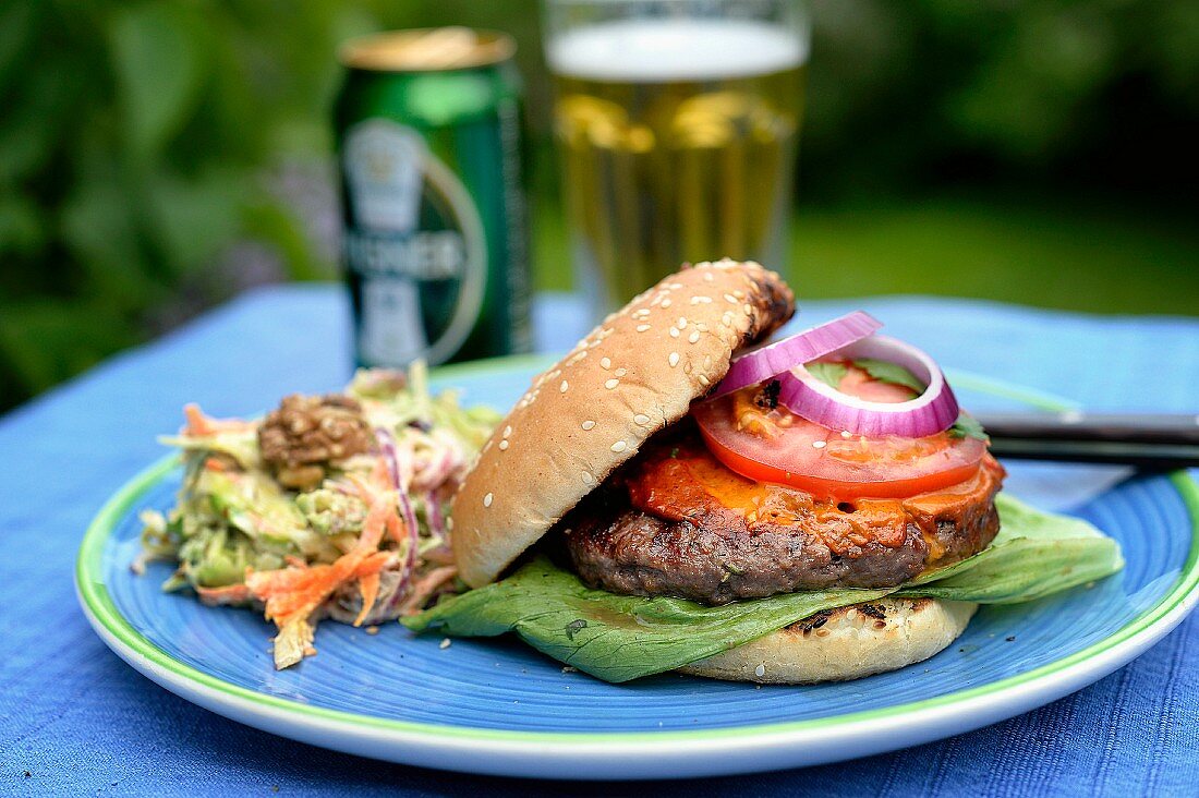 A lamb burger with onion and salad