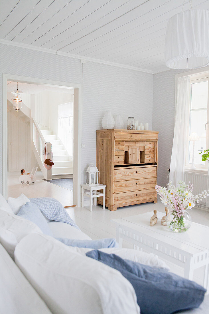 Pale wooden bureau in living room