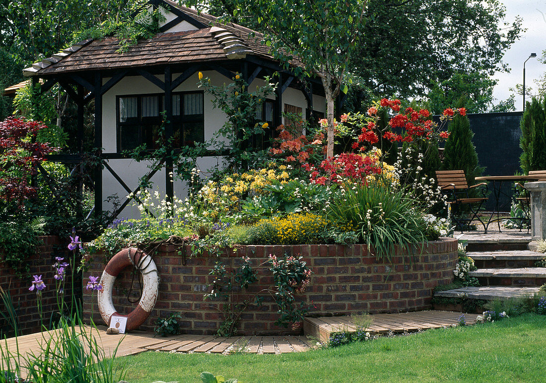 Garden house with azaleas, columbines