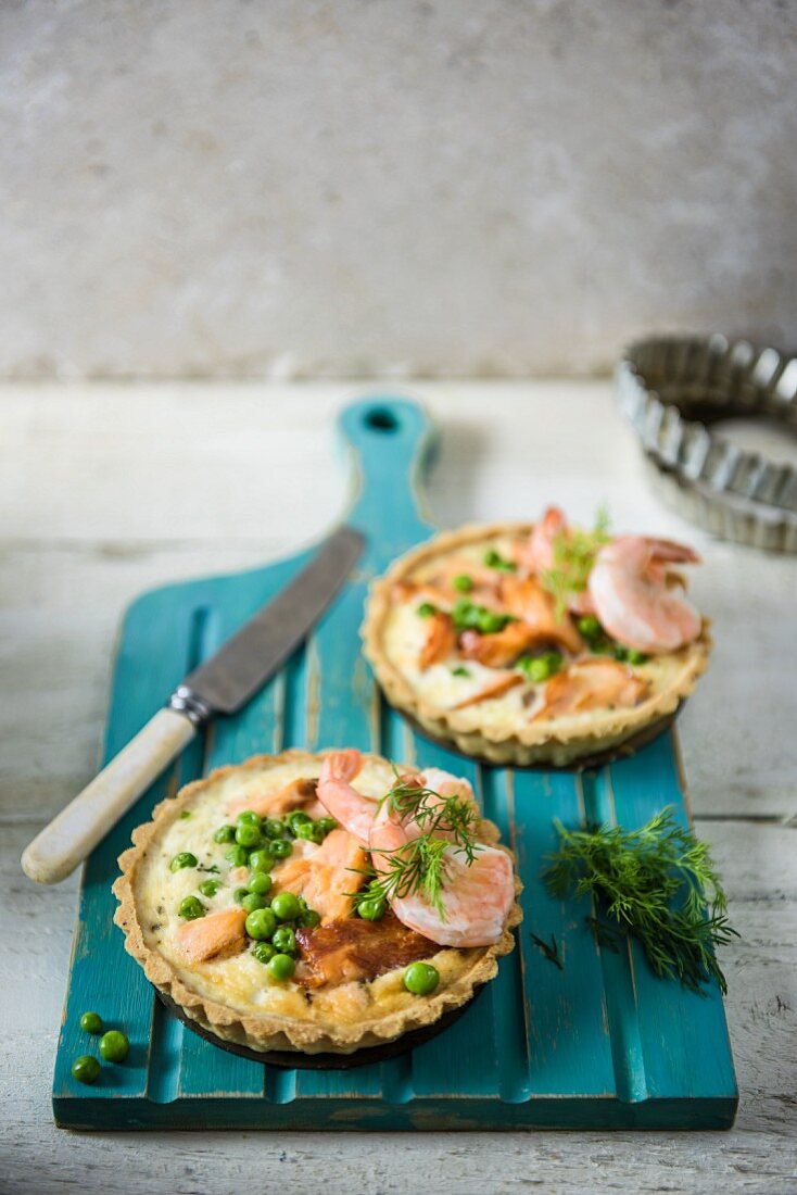 Savoury salmon and prawn tartlets with dill and peas