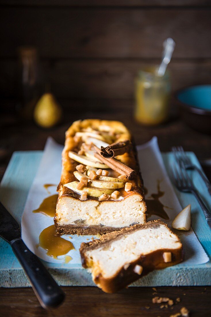 Toffee and pear cheesecake, with a slice removed