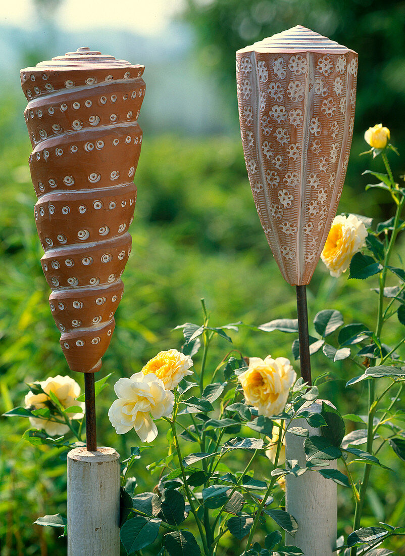 Clay snail and clay cone frost-proof as garden art