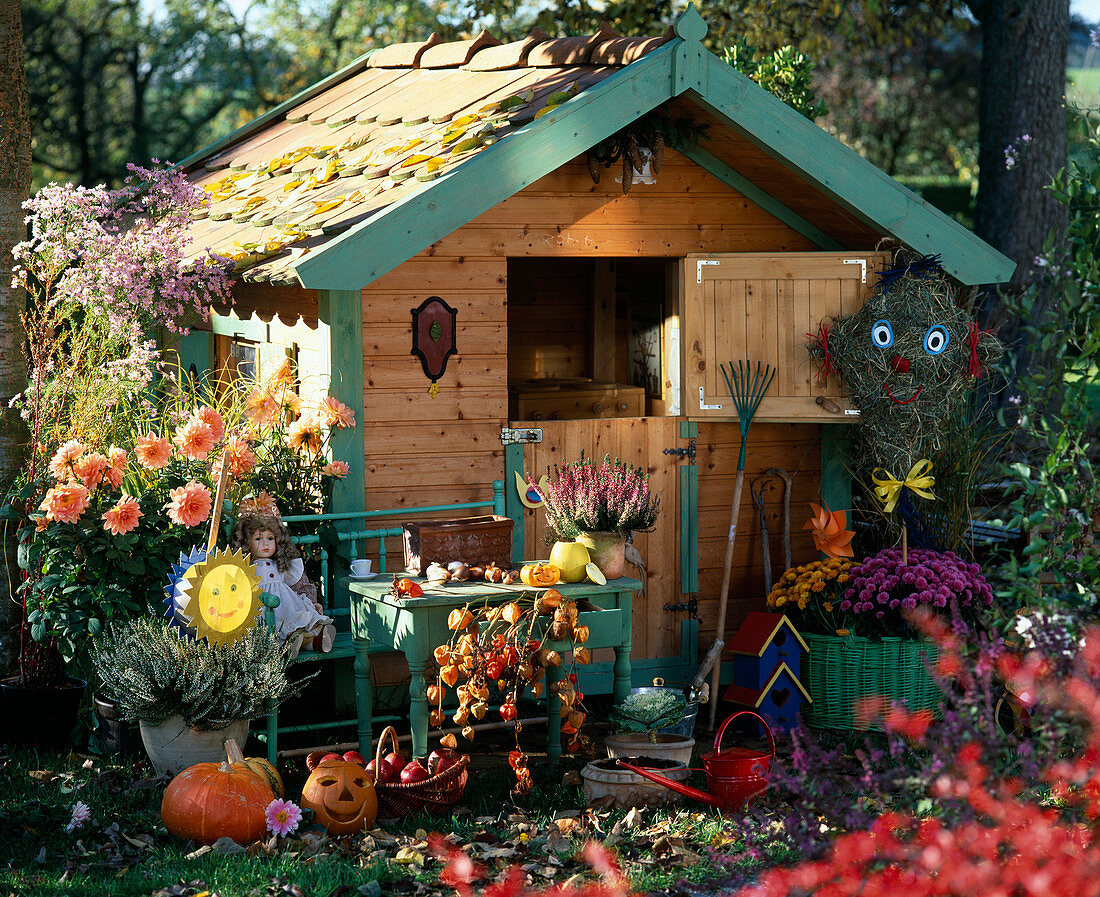 Children's playhouse in the autumn garden