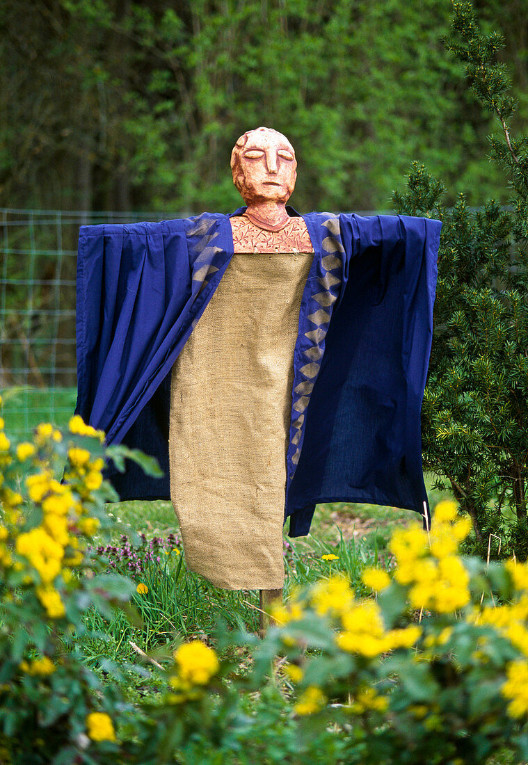 Scarecrow made of clay and fabric
