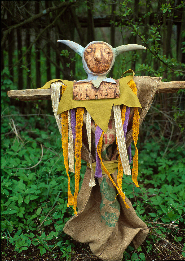 Funny scarecrow made of clay and linen