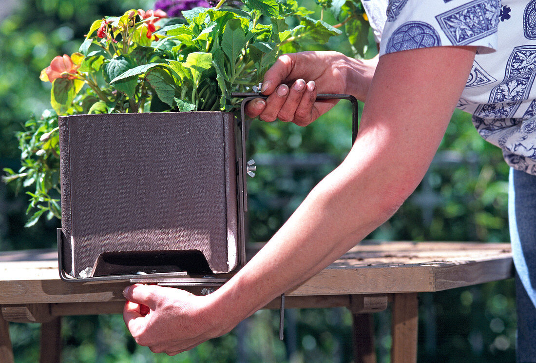 Step 12: Adjust the balcony box holder