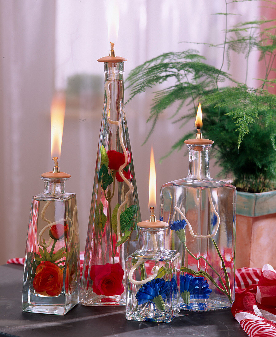 Oil candles with silk flowers