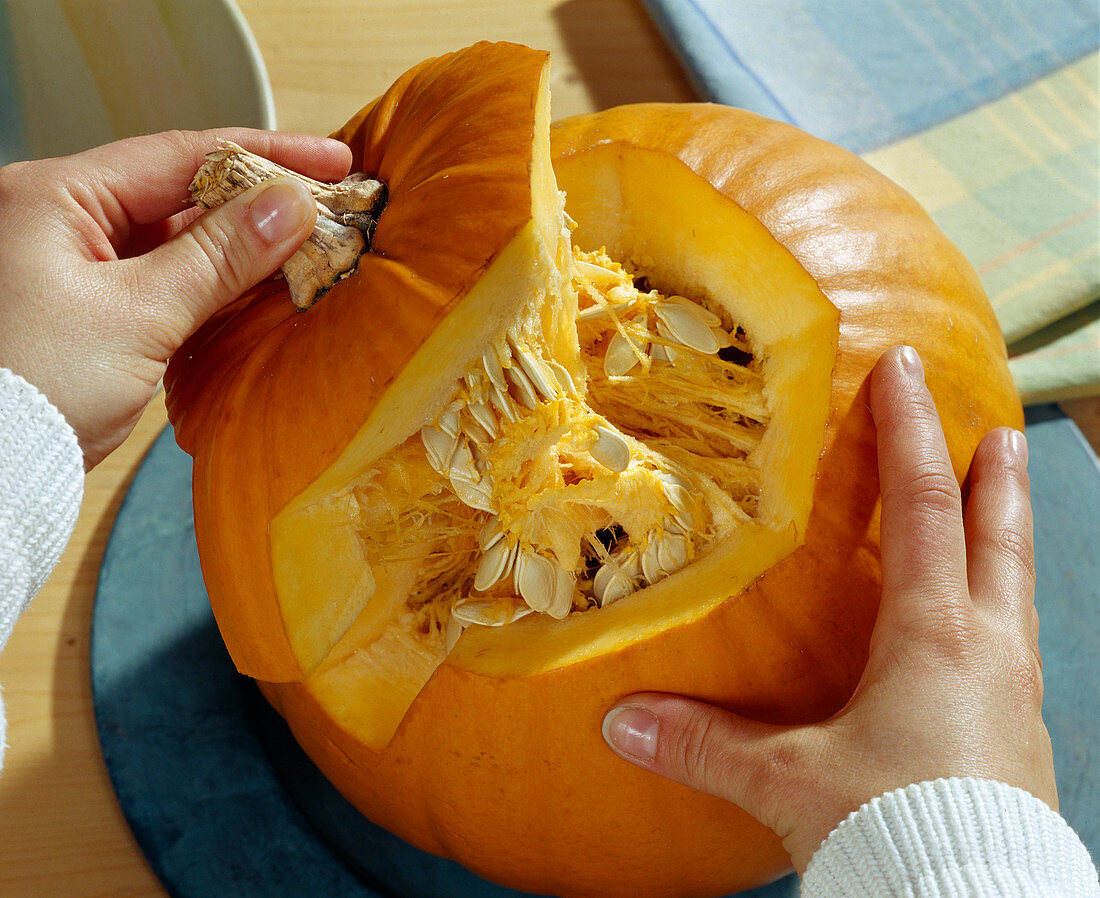 Hollow out the pumpkin, lift off the lid