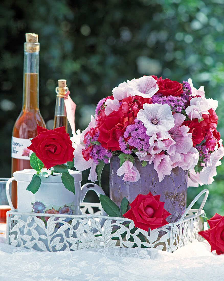 Bouquet of red roses, Lavatera trimestris 'Sivercup'