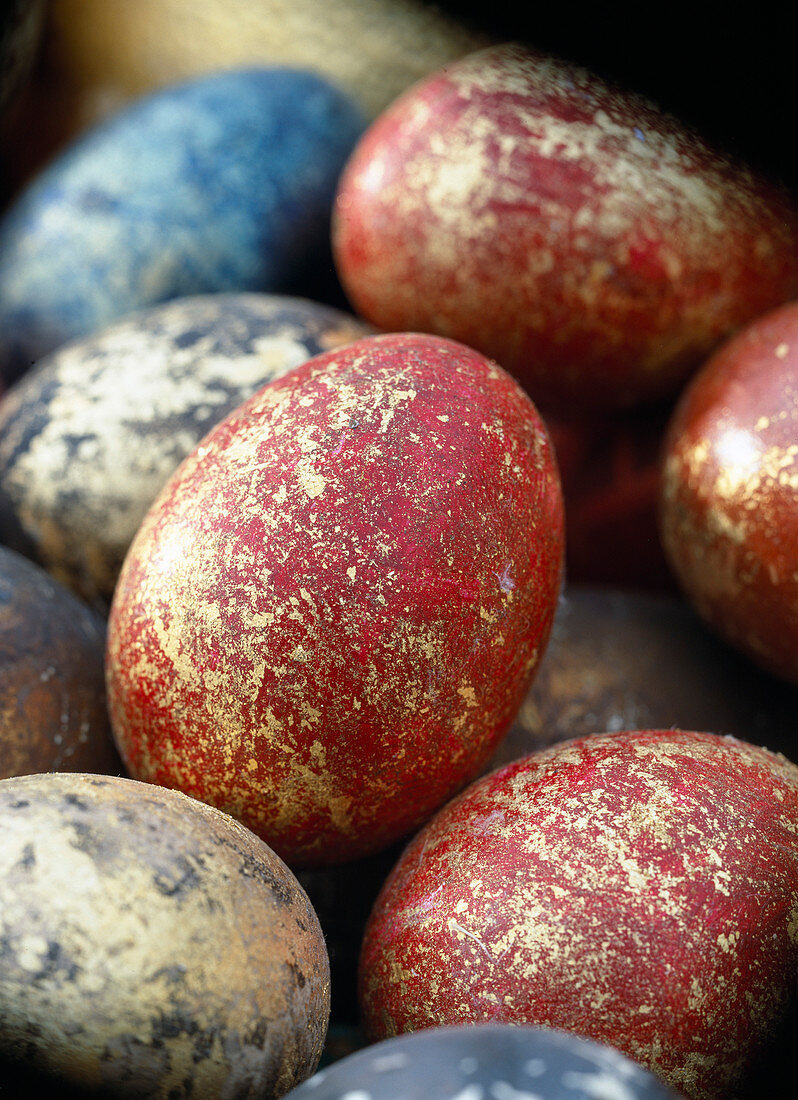 Easter eggs marbled with gold leaf and paint