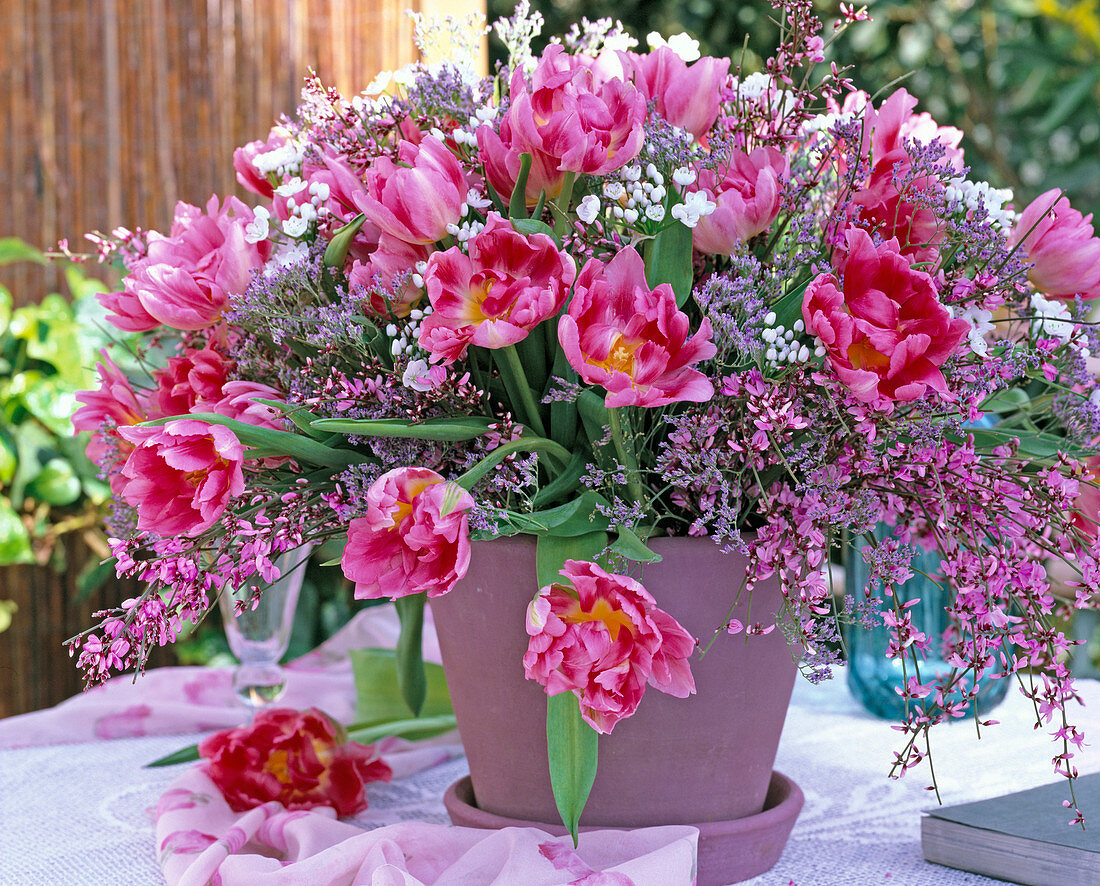 Spring bouquet made with tulips, Cytisus (broom), Limonium