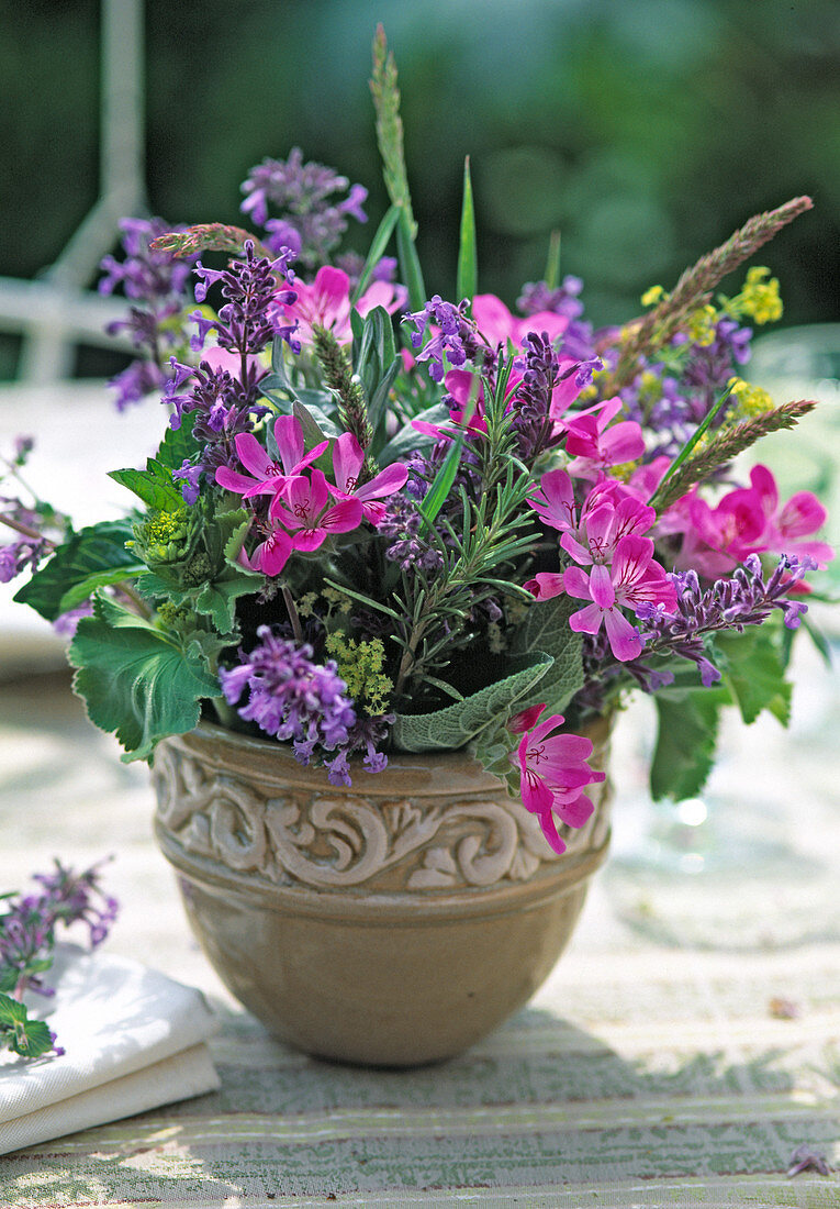 Herbal bouquet with pelargonium (geranium), rosemary