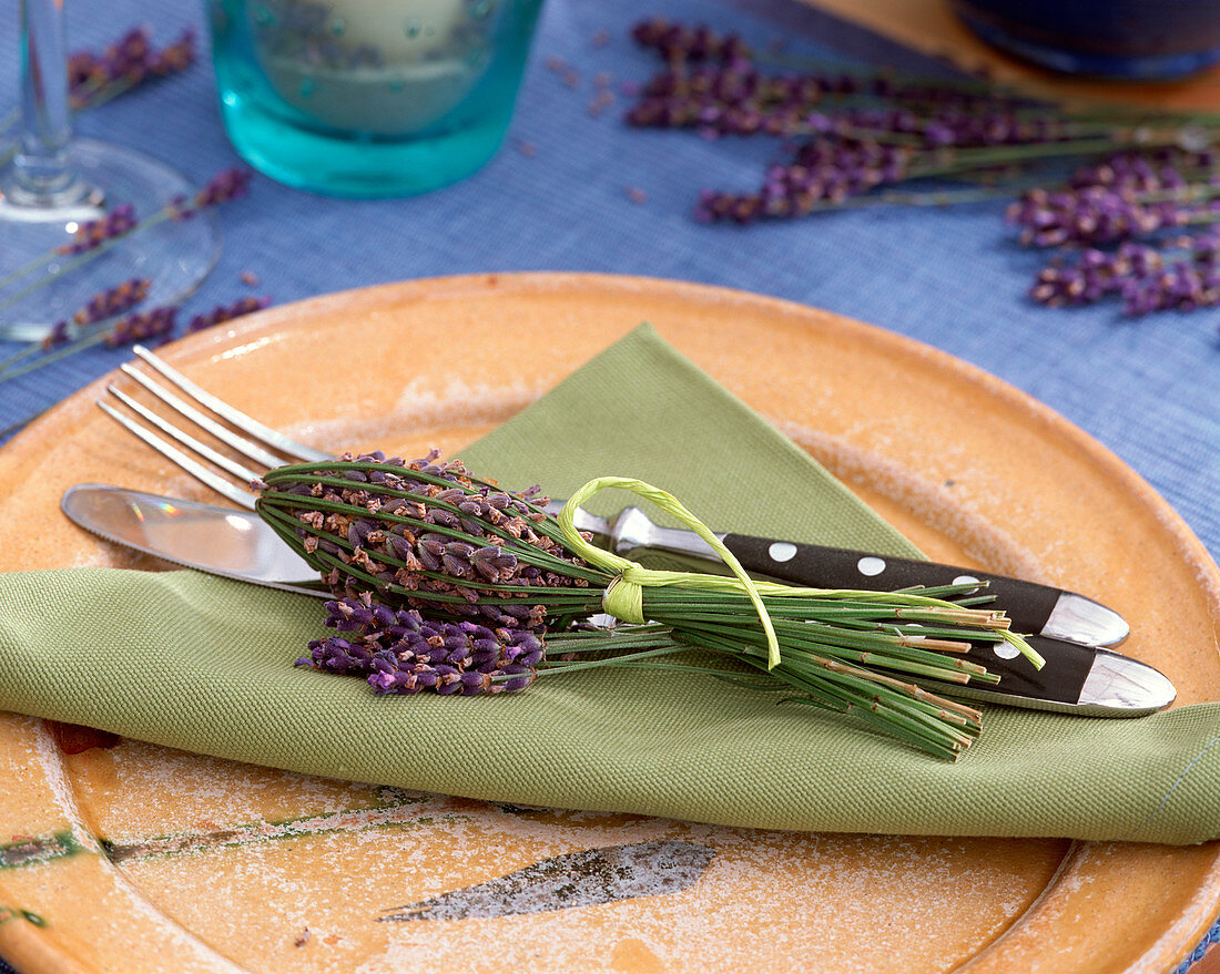 Lavandula (Lavender) and lavender bottle as napkin decoration