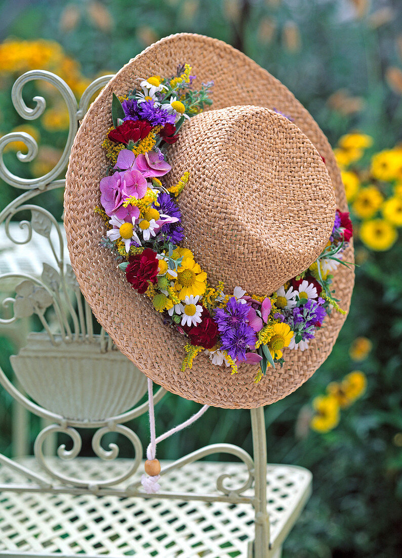 Straw hat with flower wreath