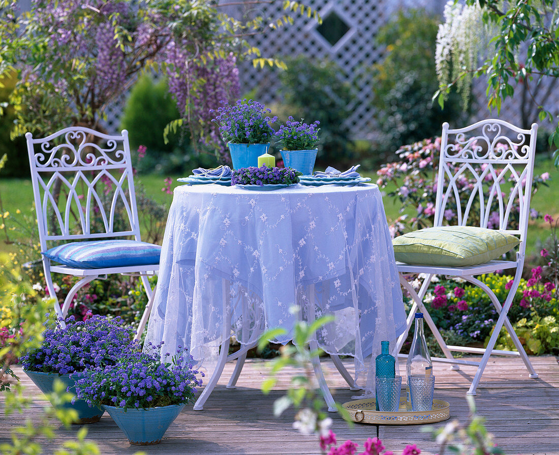 Seating group with forget-me-nots as decoration