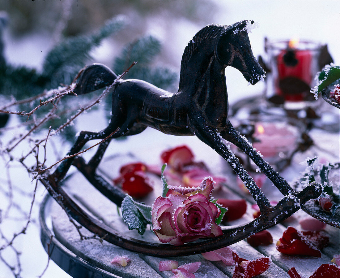 Rocking horse with frozen rose (rose blossom)
