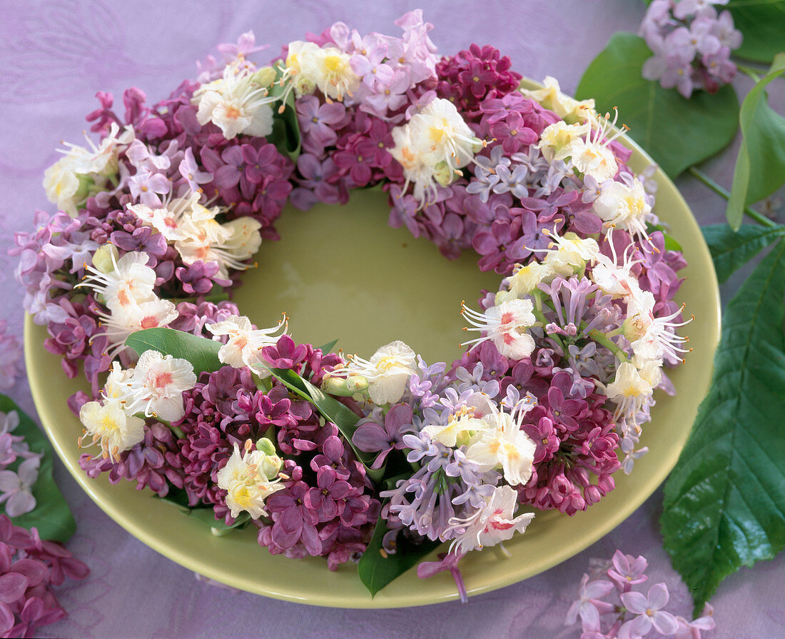 Plate wreath of lilac and chestnut flowers