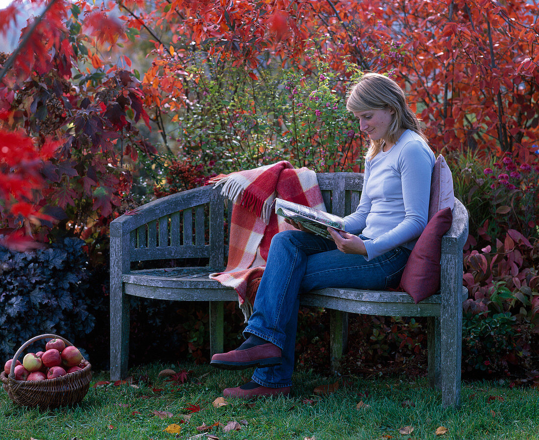 Young woman on wooden bench