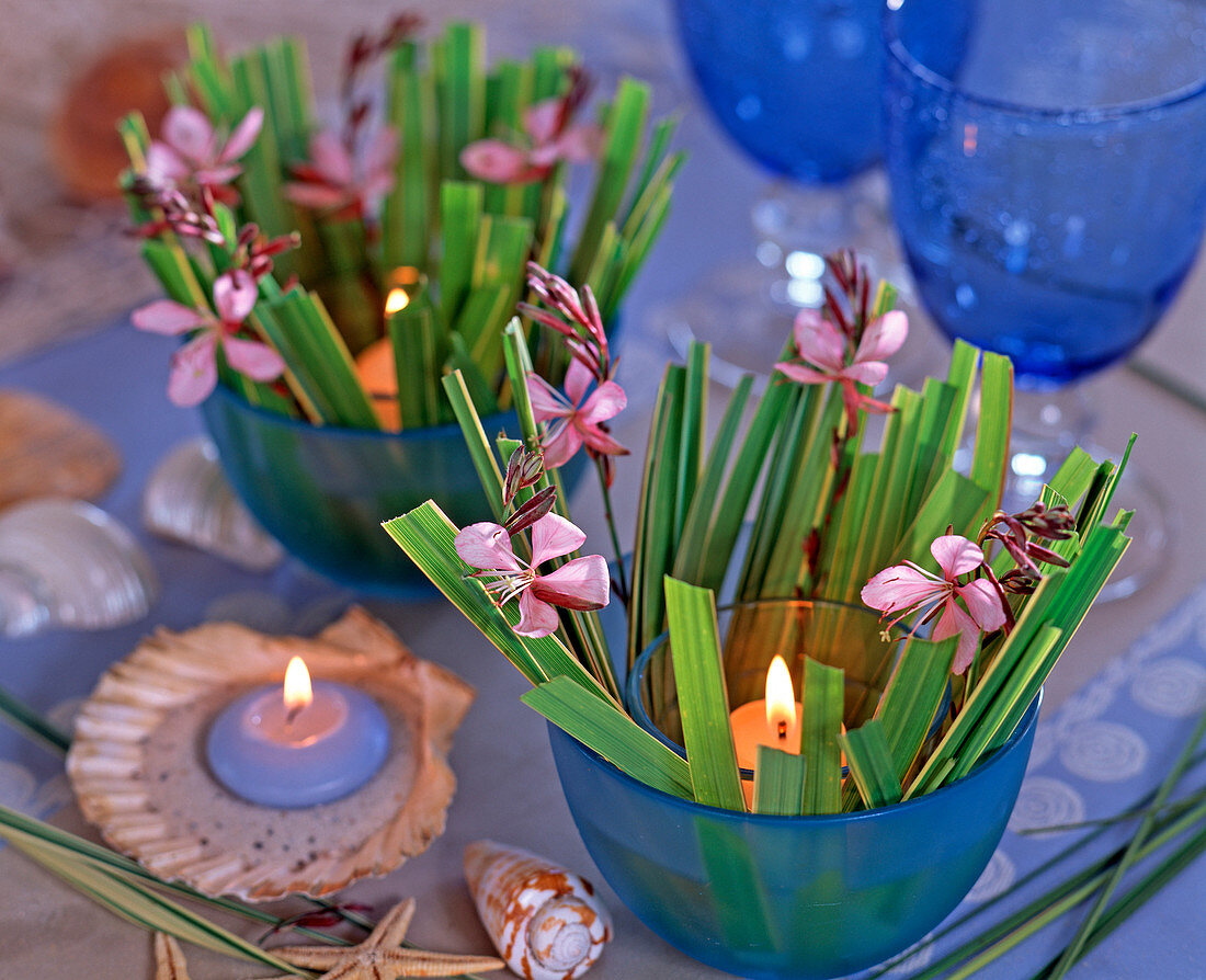 Lanterns placed in blue bowls