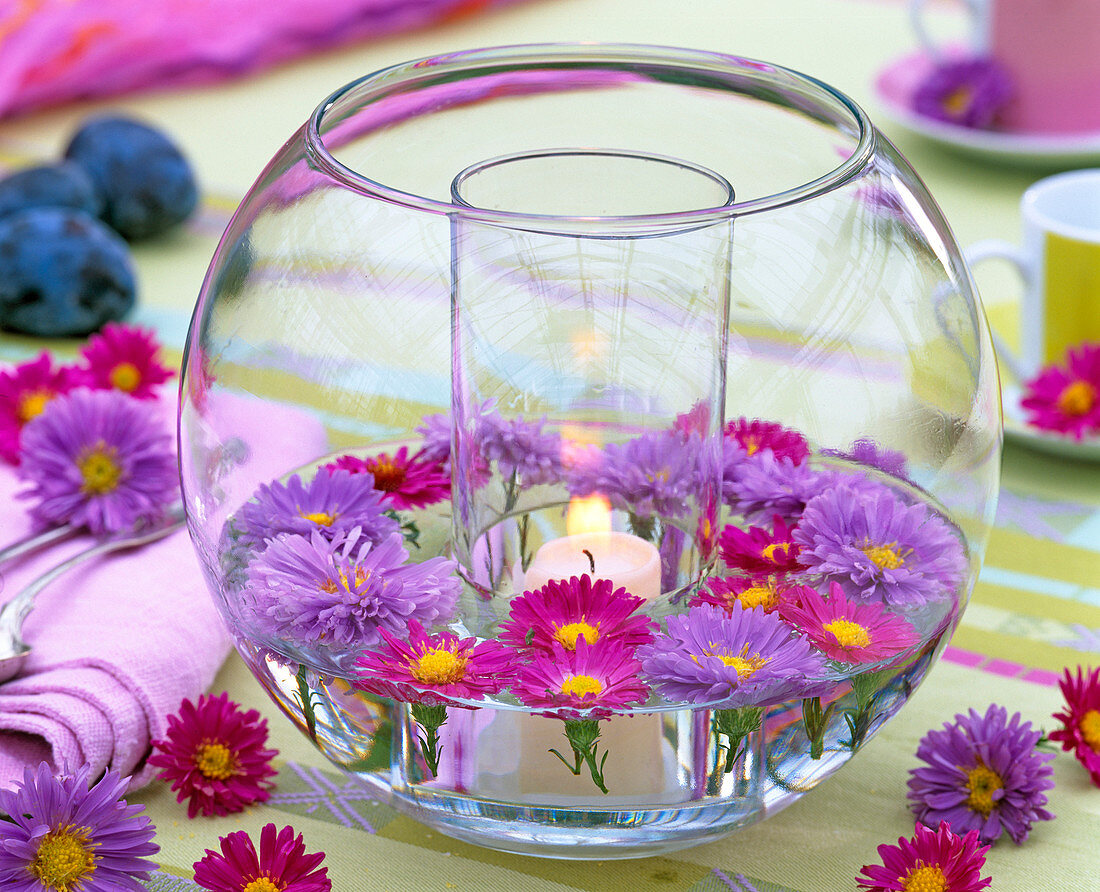 Glass with candle in spherical glass