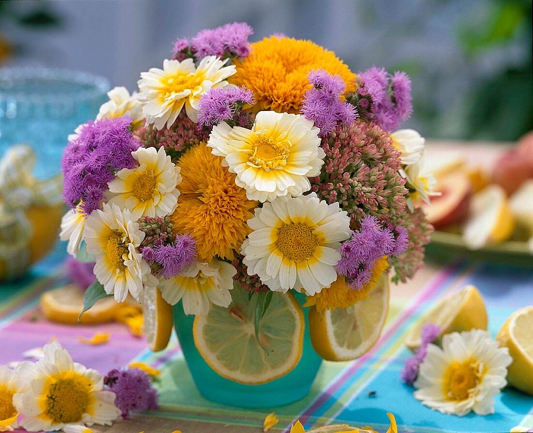 Bouquet of sunflowers, wildflowers, liverwort, stonecrop and lemon slices