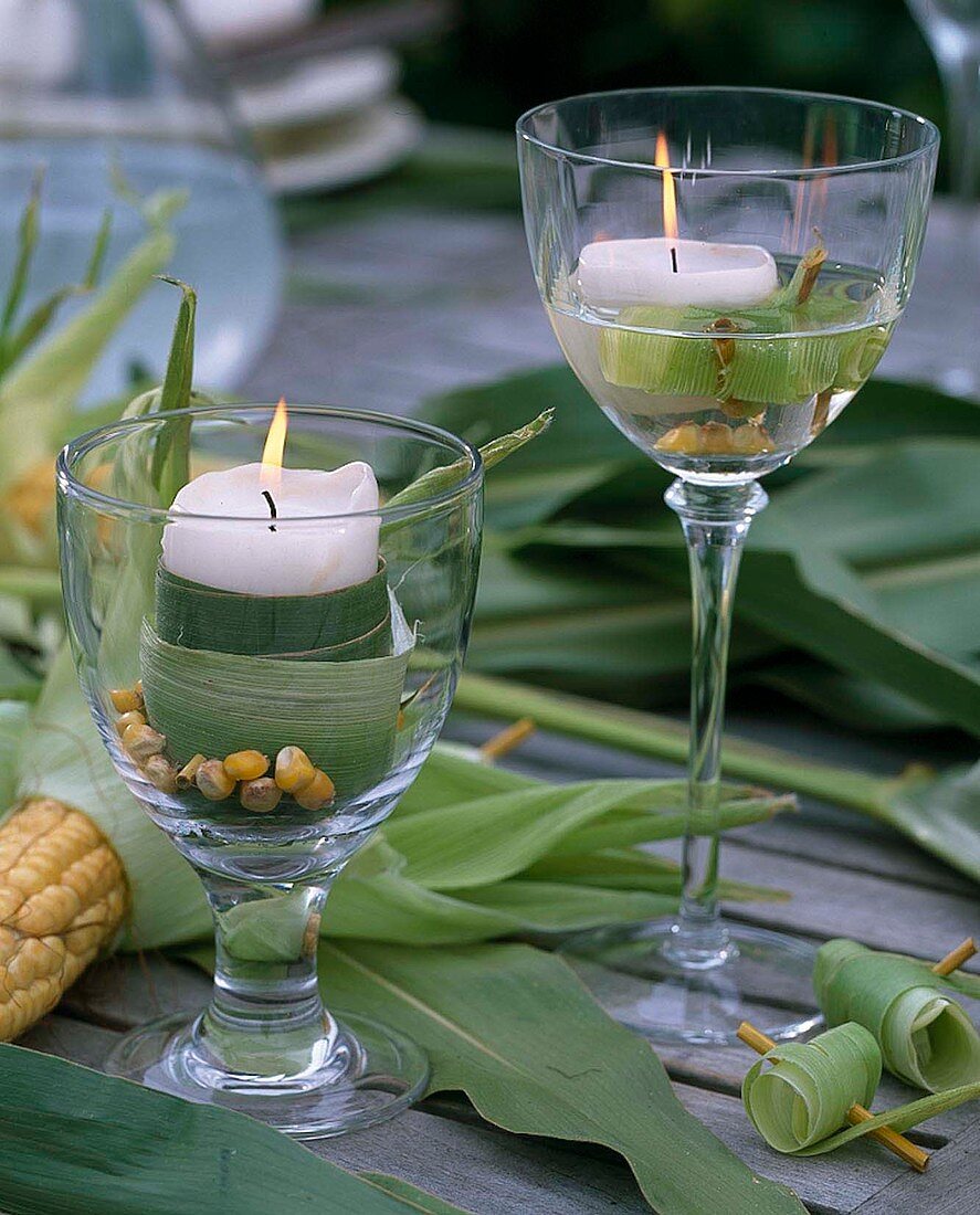 Lantern in a wine glass and floating candle