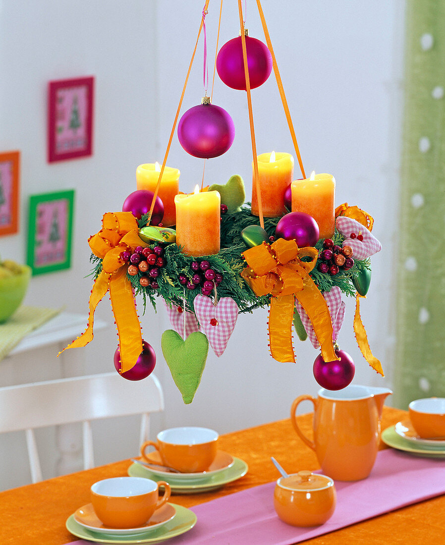 Chamaecyparis, hanging Advent wreath with orange candles