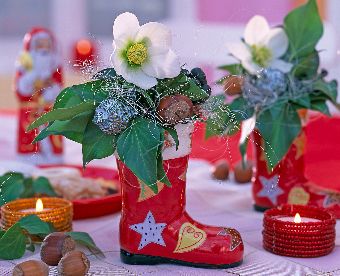 Small arrangement in colorful porcelain St. Nikolaus boots with Helleborus