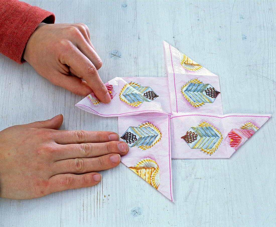 Folding a napkin into a pinwheel (6/7)