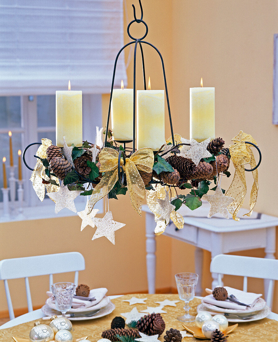 Hanging advent wreath with cones and stars