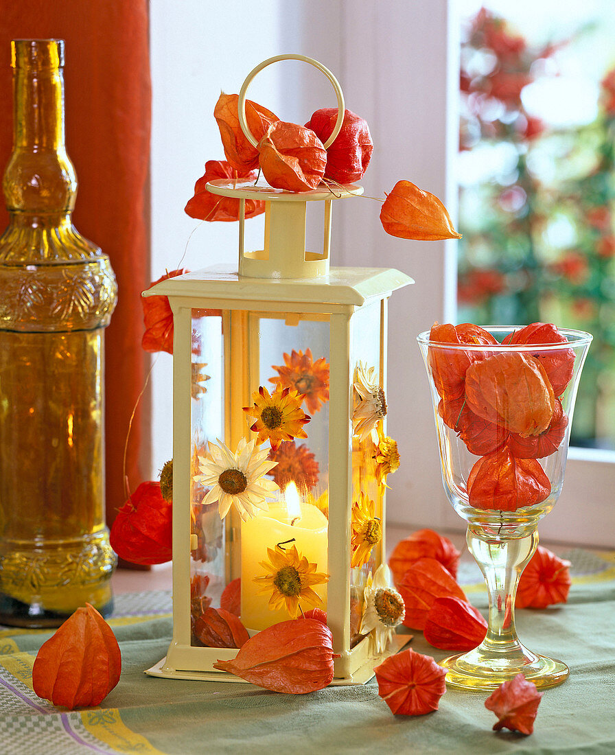 Lantern stuck with straw flowers