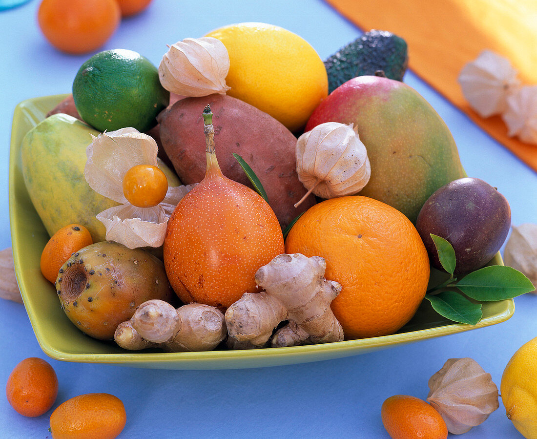 Bowl of exotic fruits, citrus (orange, lemon)