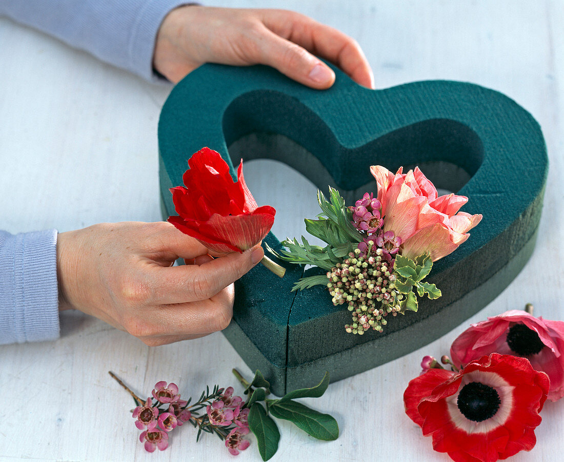 Heart with anemones, waxflower and snowball blossoms