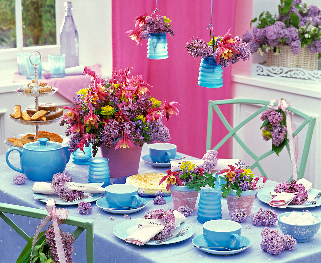 Syringa (lilac) on the table, in napkin rings and bouquets