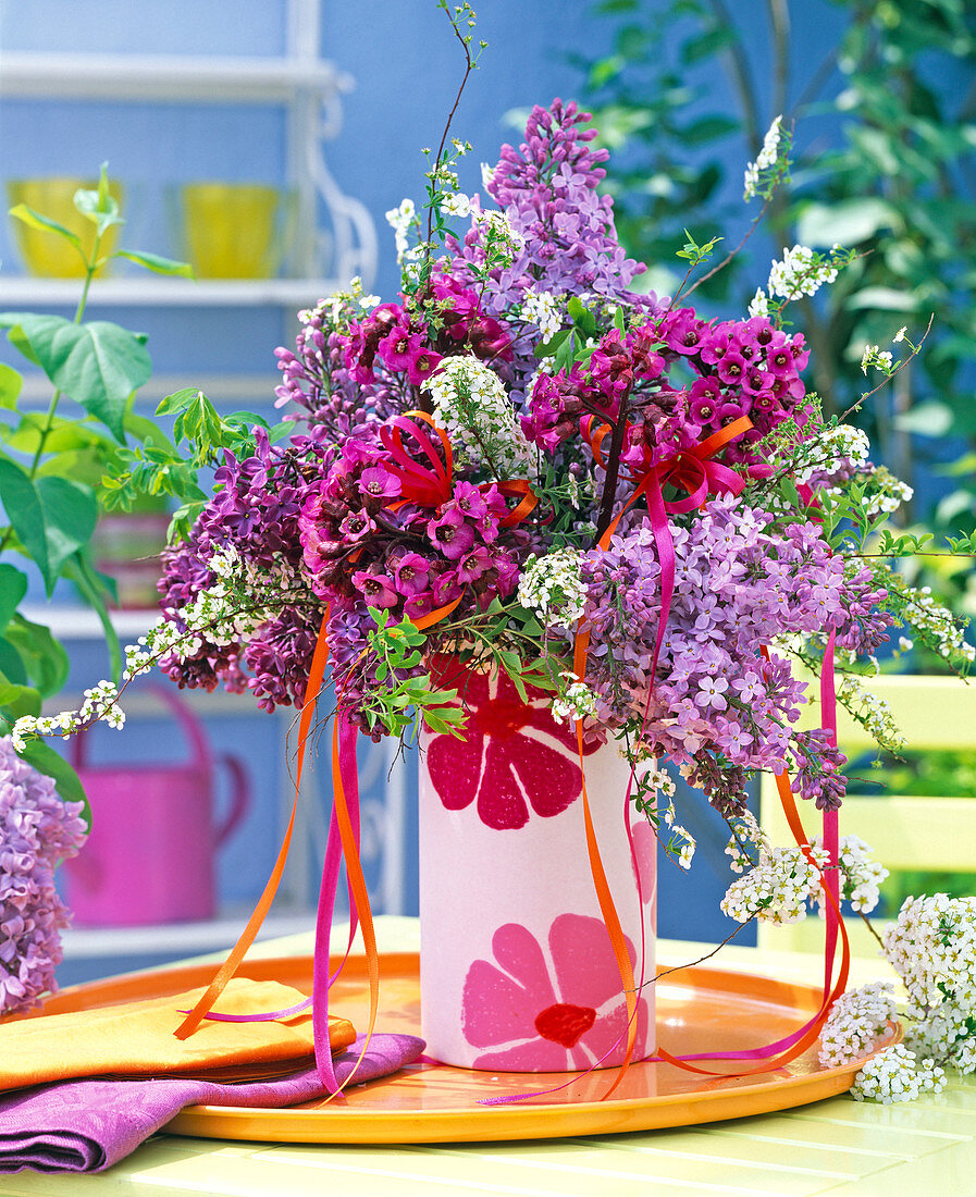 Bouquet of purple syringa, Rose Bergenia