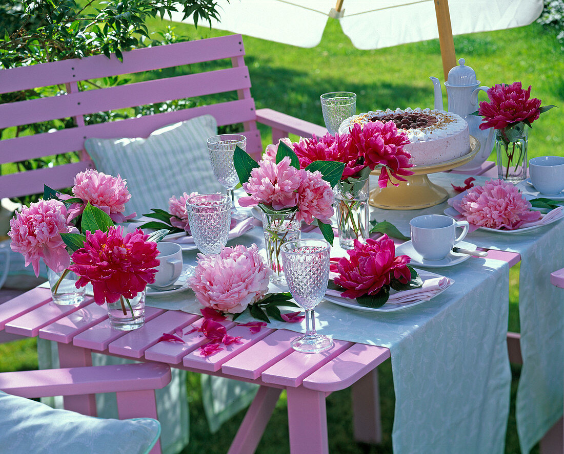 Table decoration with Paeonia, light blue coffee cover, cake