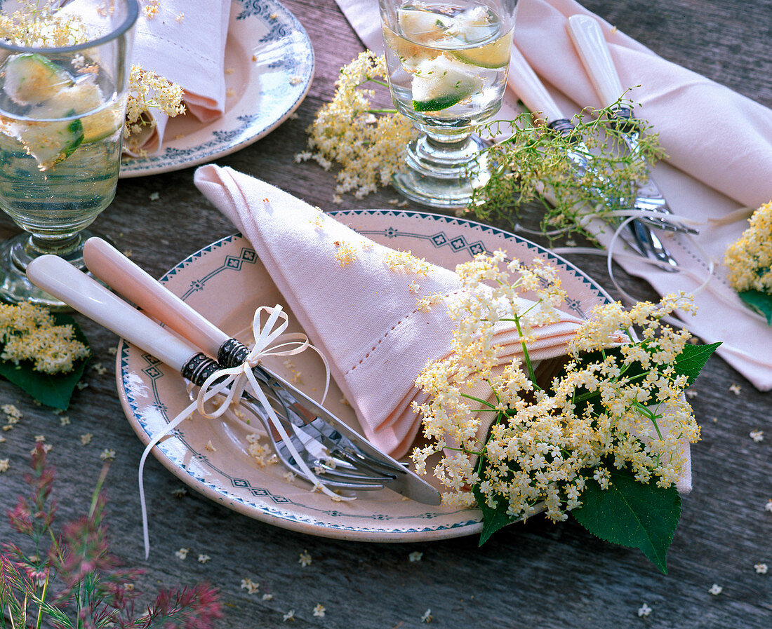 Sambucus flowers in a bag-like rolled cloth napkin