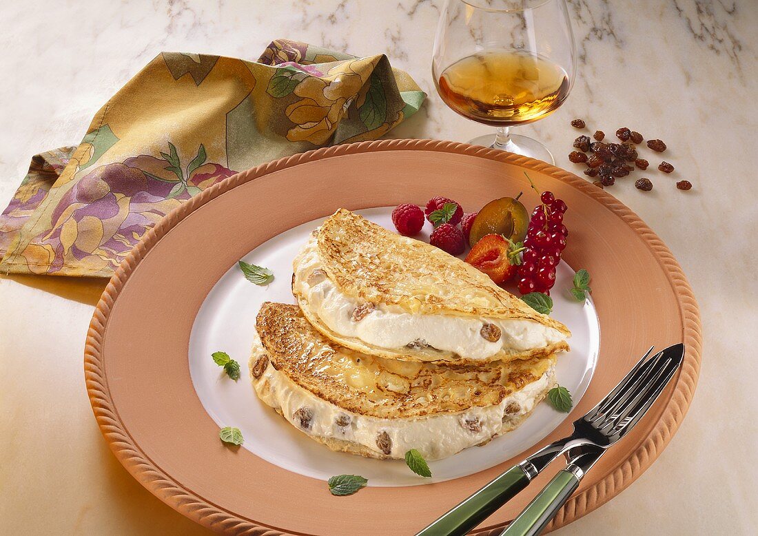 Pancake with quark and raisin filling served on a plate