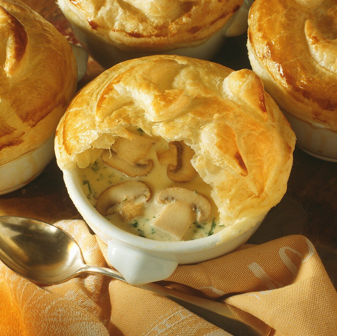 Mushroom soup with button mushrooms under puff pastry 