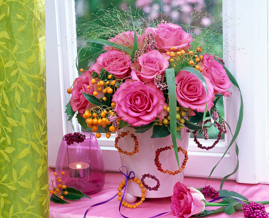 Bouquet of pink Rosa 'Sweet Uniqe' (roses), Photinia (medlar)
