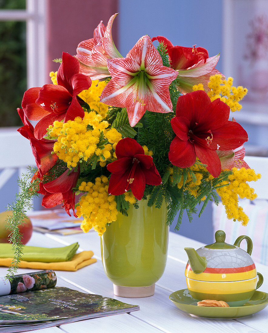 Yellow-red winter bouquet with Hippeastrum, Acacia