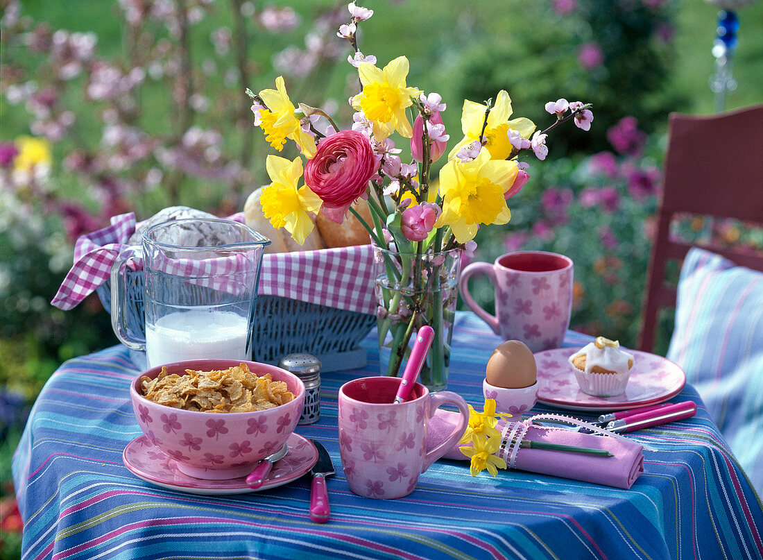 Breakfast table with a bouquet of Narcissus, Prunus