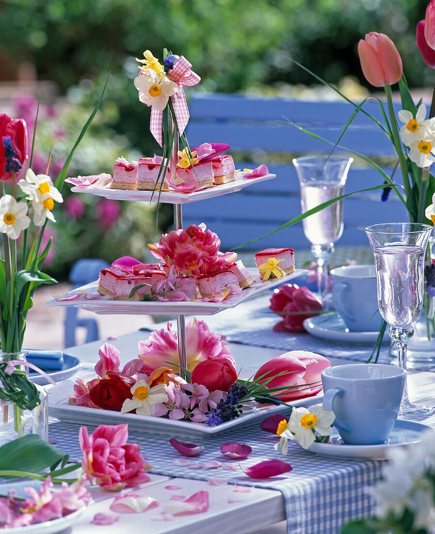 Etagere with flowers of Tulipa, Narcissus, Prunus