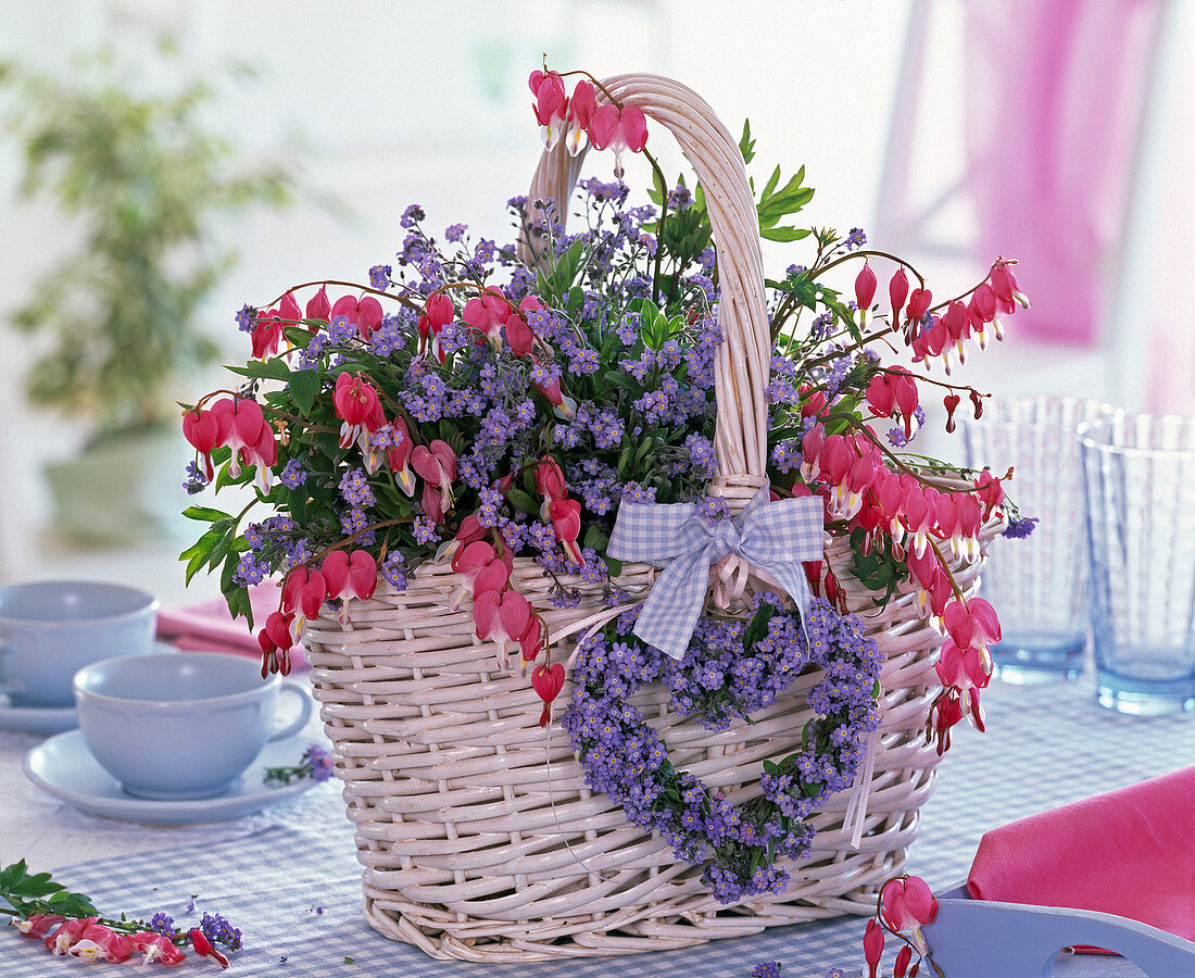 White basket with myosotis, dicentra