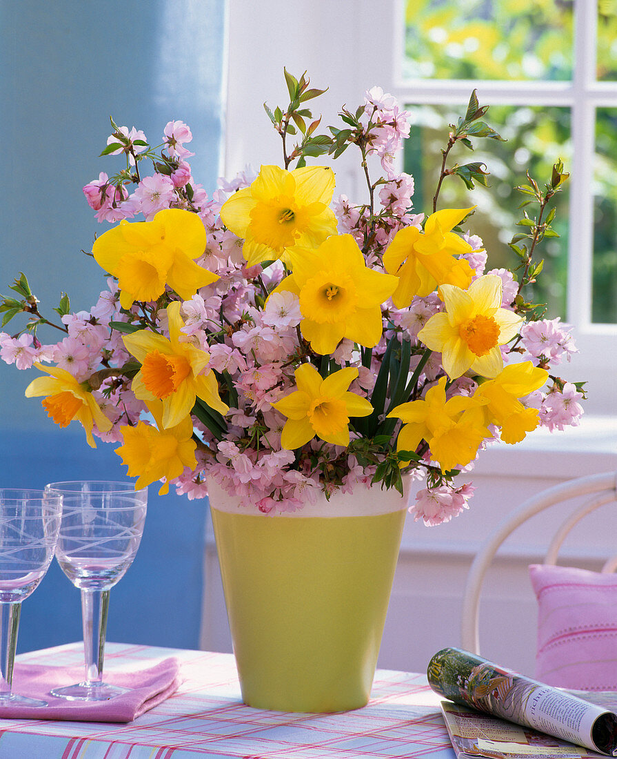 Bouquet made of ornamental cherries and pinned daffodils