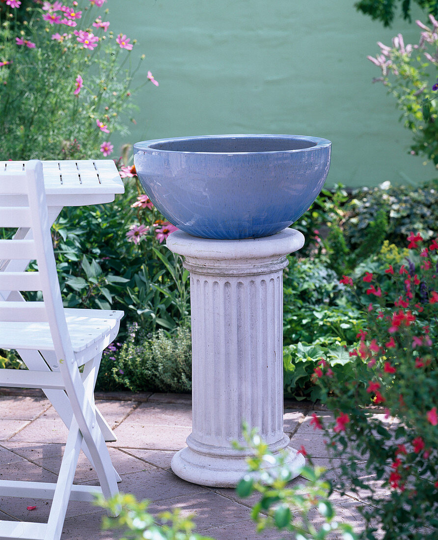 Variations of bowl: Glazed bowl on pillar, chair, table