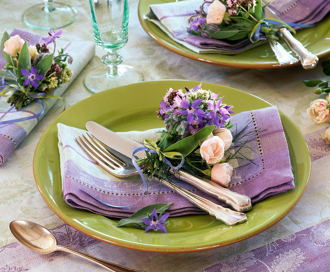 Table decoration with herbs and roses