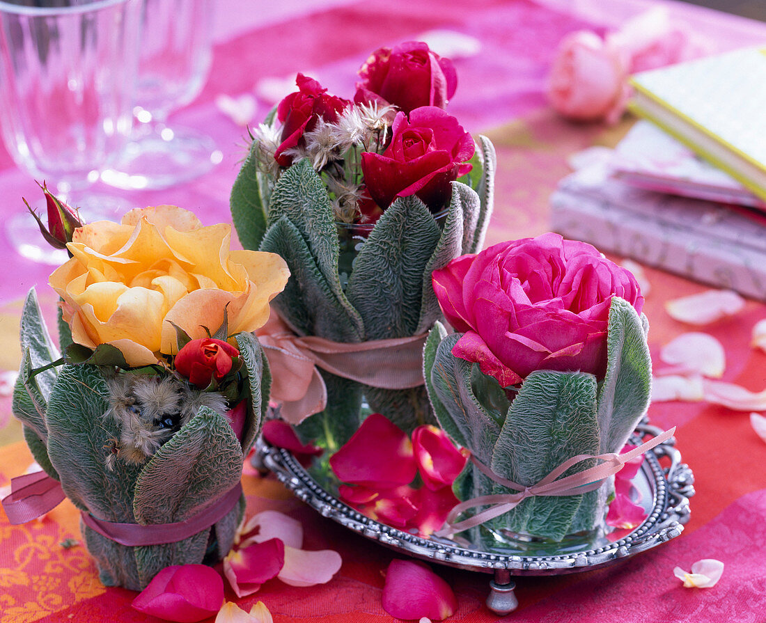 Roses in vase with leaves cover