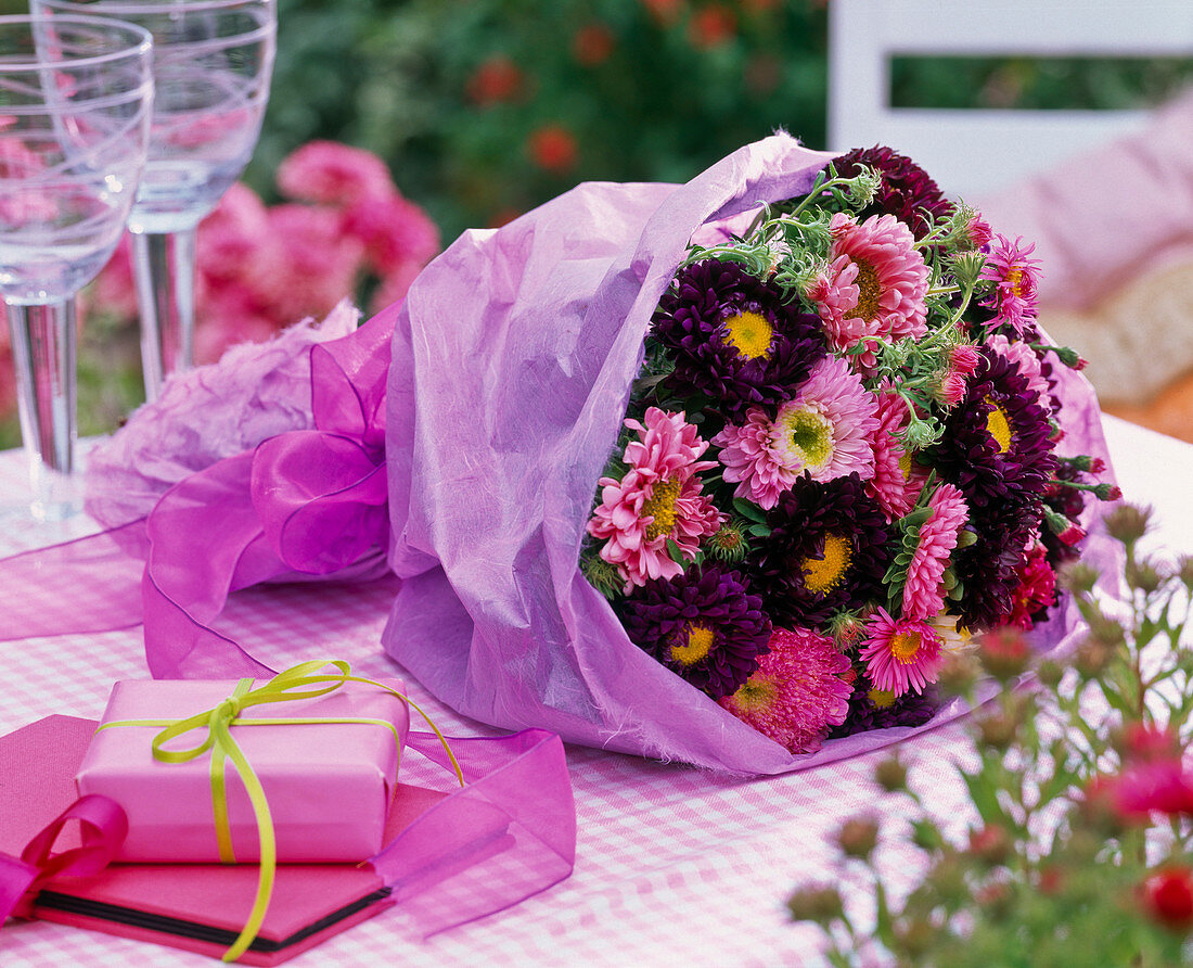 Bouquet of Callistephus (Summer Aster) in purple paper, gift