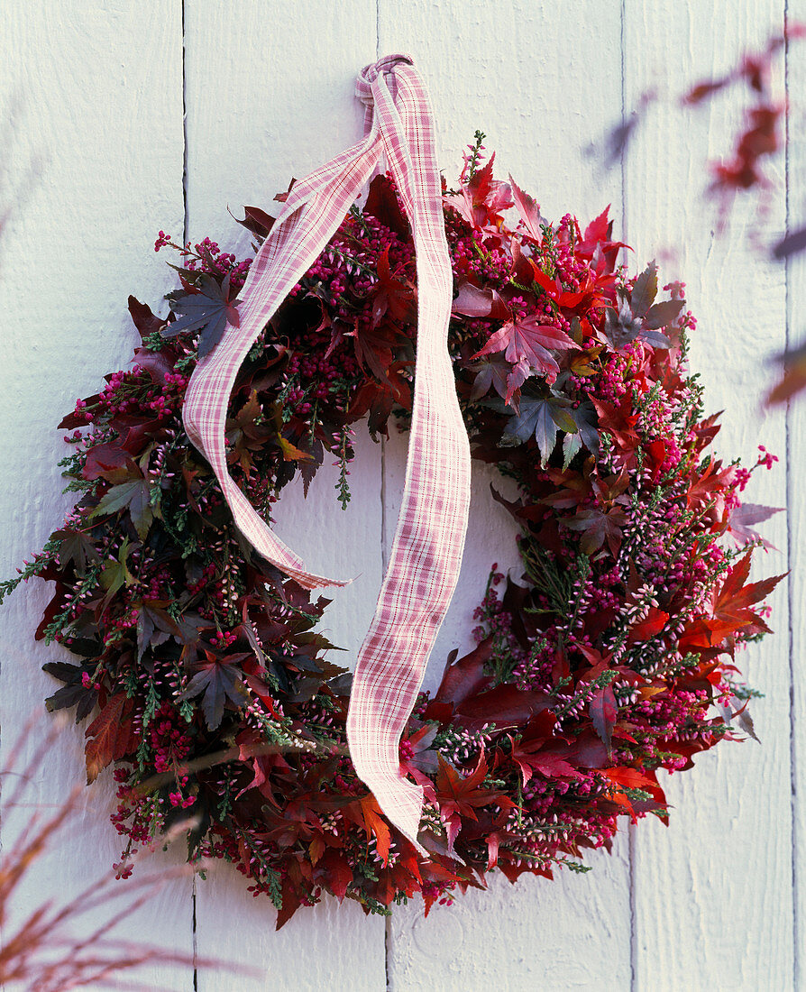 Wreath made of Calluna (broom heather), Erica (bell heather), autumn leaves of Acer